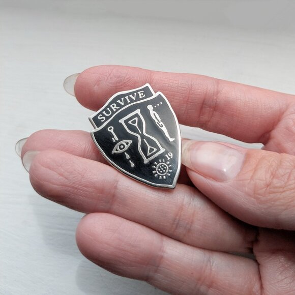Survive Silver and Black Metal Enamel Shield Pin - Occult, Alchemy, Goth, Witchy - Picture 2 of 3